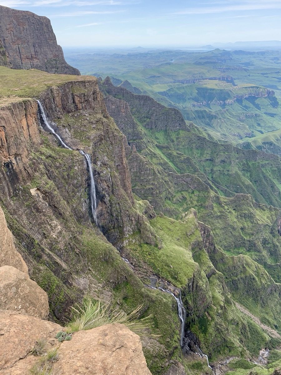 Tugela Falls in South Africa's Drakensberg mountains, showing multiple tiers of the waterfall dropping down the escarpment in a wide seasonal flow