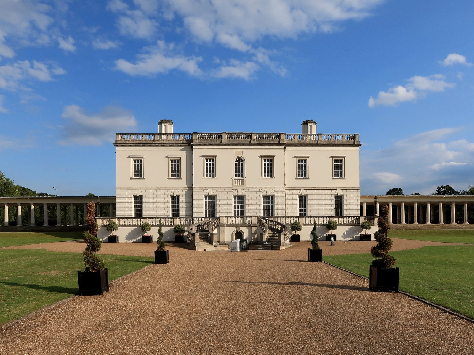 The Queen's House in Greenwich, London, showing its symmetrical white facade and colonnaded wings, the first fully Palladian building completed in England