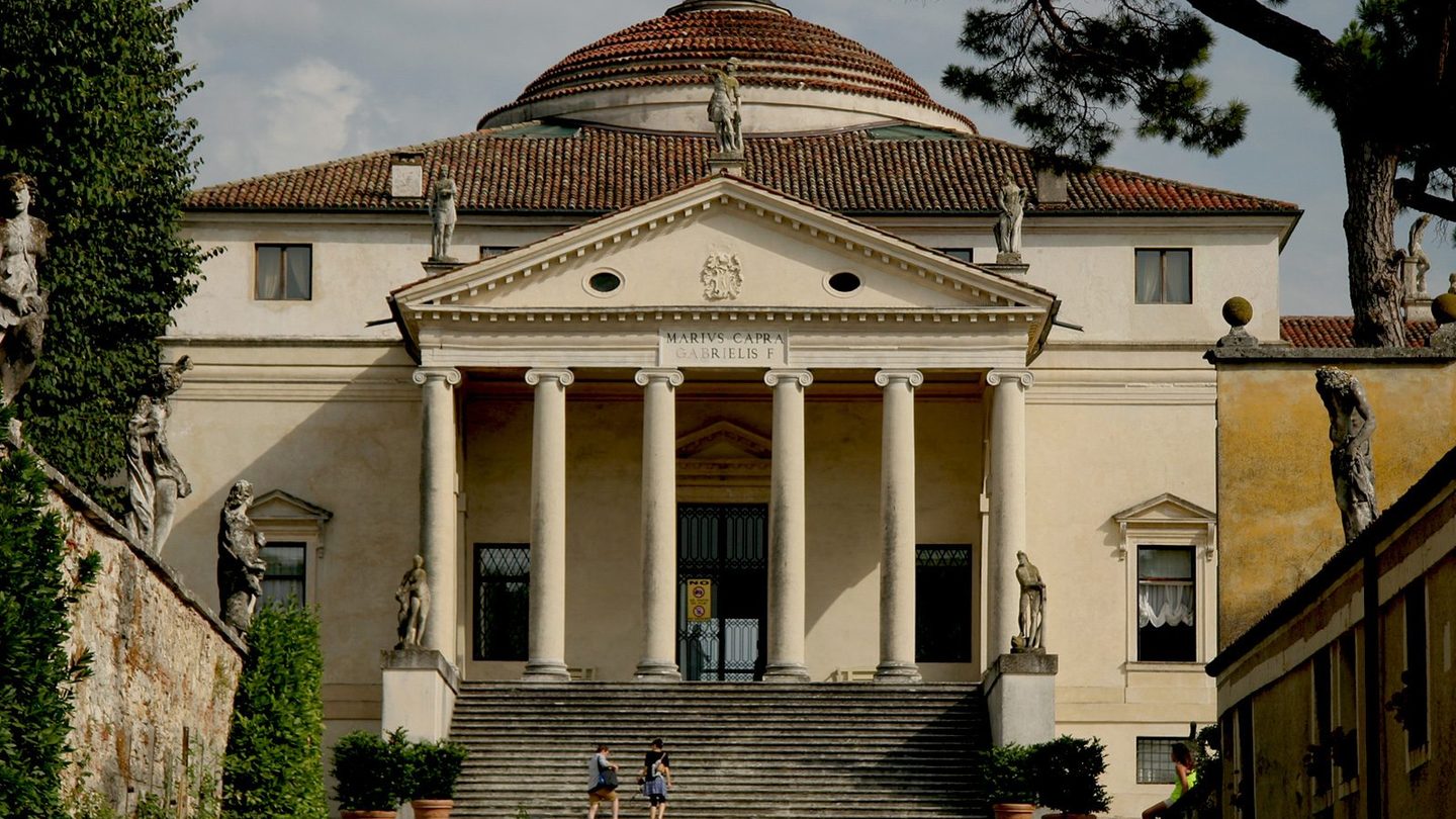 Villa Rotonda outside Vicenza, Italy, a symmetrical square block topped by a central dome, with a Roman temple-front portico of columns and a pediment on the visible facade